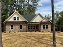 Lovely brick home showcasing a welcoming front entrance and manicured landscaping at 315 Bonaventure Dr, Salisbury, NC 28147