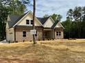 Charming brick home with a well-maintained front yard, enhancing its curb appeal at 315 Bonaventure Dr, Salisbury, NC 28147