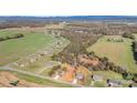 Aerial view of a residential area with houses and open fields at 1244 Bob Falls Rd, Shelby, NC 28150