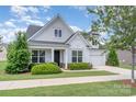 Beautiful exterior view of this two-story home with a well-maintained lawn and attached garage at 3029 Quinebaug Rd, Fort Mill, SC 29715