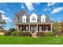 Brick home with dormer windows and a covered porch at 4815 Sugar And Wine Rd, Monroe, NC 28110