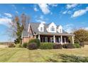 Brick house with a covered porch and landscaping at 4815 Sugar And Wine Rd, Monroe, NC 28110