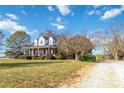 Brick home with wrap-around porch and mature trees at 4815 Sugar And Wine Rd, Monroe, NC 28110