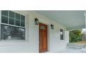 Renovated front door with sidelights and arched window at 119 Nat Barber Ave, Gastonia, NC 28052