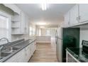 Galley kitchen with stainless steel appliances and white cabinets at 2209 Dale Ave, Lincolnton, NC 28092