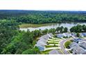 Stunning aerial view of lakeside homes surrounded by lush greenery and serene waters at 25622 Seagull Dr # 645, Lancaster, SC 29720