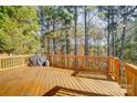 Large wooden deck ideal for outdoor relaxation, surrounded by mature trees at 25622 Seagull Dr # 645, Lancaster, SC 29720