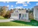 Beautifully landscaped home with a lush lawn, inviting curb appeal, and spacious garage at 25622 Seagull Dr # 645, Lancaster, SC 29720