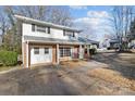 Brick home with attached garage and walkway at 2810 Daleview Dr, Charlotte, NC 28214