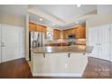 Bright kitchen featuring a large island, stainless steel appliances, and hardwood floors at 4919 Polo Gate Blvd, Charlotte, NC 28216