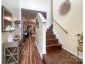 Inviting foyer with hardwood floors, staircase, high ceilings, decorative accents and seamless access to the living spaces at 1096 Mountain Laurel Ct, Matthews, NC 28104