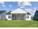 Screened porch provides an outdoor space with ceiling fan and views of the backyard at 9088 El Sworth Dr, Sherrills Ford, NC 28673