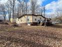 Mobile home with deck and outbuildings at 325 Scaley Bark Dr, Salisbury, NC 28147