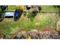 Overhead view of large green pasture and outbuildings at 448 Johnson Dairy Rd, Mooresville, NC 28115