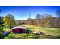 Open pasture with barn and power lines in background at 448 Johnson Dairy Rd, Mooresville, NC 28115