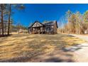 Charming new home features gray siding, a welcoming porch, and a landscaped yard at 1863 Filbert Hwy, York, SC 29745