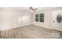 Bright living room with modern vinyl floors and a large window, providing natural light at 1681 Evans Dr, Lancaster, SC 29720