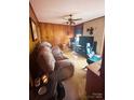 Living room with wood paneling, fireplace, and tv at 1895 Forest Lake Dr, Rock Hill, SC 29732