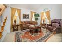 Cozy living room with a fireplace and comfortable seating at 2111 Priory Ct, Charlotte, NC 28262