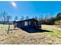 Log home exterior with deck and fenced yard at 5199 Helms End Of Trl, Lincolnton, NC 28092