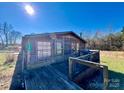 Rustic home with wooden deck and grill at 5199 Helms End Of Trl, Lincolnton, NC 28092