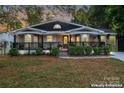 Inviting curb appeal with a renovated front porch and landscaping at 138 Wyanoke Ave, Charlotte, NC 28205