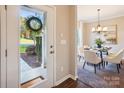 Inviting entryway featuring a view into the dining room with neutral walls and hardwood flooring at 6003 Hawk View Rd, Waxhaw, NC 28173