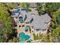 Luxury home with solar panels and a beautiful pool at 16908 Ashton Oaks Dr, Charlotte, NC 28278