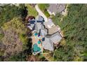 Large home situated on a wooded lot with a pool at 16908 Ashton Oaks Dr, Charlotte, NC 28278