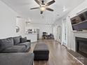 Spacious living room featuring a fireplace and dark gray sectional sofa at 216 Devon Forest Dr, Mooresville, NC 28115