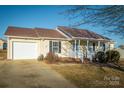 House exterior showcasing a carport and landscaping at 2306 6Th Nw Ave, Hickory, NC 28601