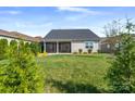 Private backyard with screened porch and lush landscaping at 6235 Scuttle Ln, Denver, NC 28037