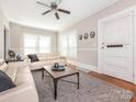 Inviting living room featuring hardwood floors, neutral paint, and a ceiling fan at 1411 Lineberger Ave, Gastonia, NC 28052