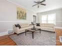 Inviting living room featuring hardwood floors, neutral paint, and a ceiling fan at 1411 Lineberger Ave, Gastonia, NC 28052