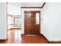 Bright foyer featuring hardwood floors, a large front door, and a glimpse into the living area at 206 Swaim Ct, Salisbury, NC 28147