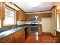 Traditional kitchen with wood cabinetry, modern appliances, and plenty of counter space at 206 Swaim Ct, Salisbury, NC 28147