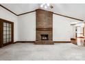 Inviting living room with brick fireplace, hardwood floors, and natural light at 206 Swaim Ct, Salisbury, NC 28147