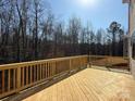 Expansive wooden deck offers a serene outdoor space, perfect for entertaining and relaxation at 2387 Trundle Dr # Cwo0155, Gastonia, NC 28054