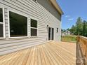 A wooden deck is attached to home that overlooks a beautiful backyard at 2387 Trundle Dr # Cwo0155, Gastonia, NC 28054