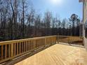 Spacious wood deck offering an outdoor living space with wooden railing and scenic view at 2387 Trundle Dr # Cwo0155, Gastonia, NC 28054