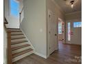 Welcoming entryway features hardwood floors, a staircase, and a view into adjacent rooms at 2387 Trundle Dr # Cwo0155, Gastonia, NC 28054