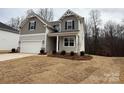 Charming two-story home with a two-car garage and a covered front porch at 2387 Trundle Dr # Cwo0155, Gastonia, NC 28054