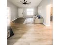 Living room features gray walls and laminate flooring at 136 Creek Branch Dr, Mooresville, NC 28115