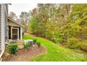 Private backyard with lush greenery and wooded backdrop at 786 Petersburg Dr, Fort Mill, SC 29708