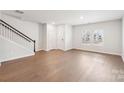 Spacious living room with hardwood floors and large windows at 115 Ciara Pl # A, Mooresville, NC 28117