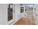 Relax on the cozy porch with comfortable seating and enjoy the view at 122 W Heart Pine Ln, Statesville, NC 28677