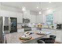 Modern kitchen with stainless steel appliances and granite countertops at 278 Harpers Run Ln, Matthews, NC 28104