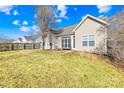 Spacious backyard with a patio and wooden fence at 136 Kristens Court Dr, Mooresville, NC 28115