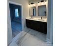 Stylish bathroom with a double vanity, modern fixtures, and marble tile floors at 914 30Th Avenue Nw Dr # 1, Hickory, NC 28601