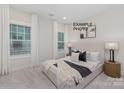 Cozy bedroom with large windows and neutral decor at 1000 Fairground St, Charlotte, NC 28208